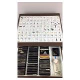Metal Box With A Variety Of Needles In It
