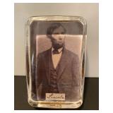 Cuff links and Abe Lincoln paperweight