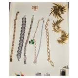 Gold/silver toned bracelets, brooch and earring set, calendar pendants