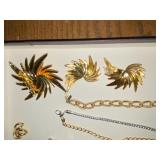 Gold/silver toned bracelets, brooch and earring set, calendar pendants