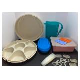 Tupperware, veggie tray, pitcher, popsicle maker some lids damaged.