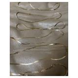 (7) gold colored chain necklaces