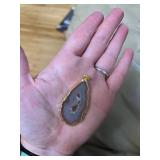 11 polished geode pendants