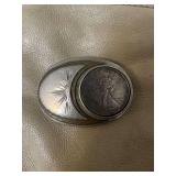 belt buckle - used - 1993 appears to be Silver Eagle