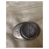 belt buckle - used - 1993 appears to be Silver Eagle
