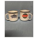 Two Coleman enamelware coffee mugs