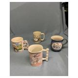 Four duck/goose themed coffee mugs