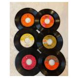 45 rpm records featuring Association, Bee Gees, Herb Albert, and more