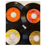 45 rpm records featuring Association, Bee Gees, Herb Albert, and more