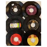 45 rpm records featuring Elvis, Bill Haley, Happenings, Stevie Wonder and more