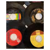 45 rpm records featuring Elvis, Bill Haley, Happenings, Stevie Wonder and more