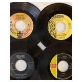 45 rpm records featuring Cher, Bette Midler, Bee Gees and more