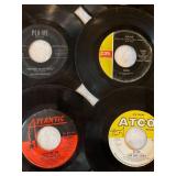 45 rpm records featuring Cher, Bette Midler, Bee Gees and more