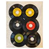 45 rpm records featuring Sly and the Family Stone, Peter, Paul, and Mary, Leslie Gore, Grassroots and more