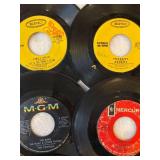 45 rpm records featuring Sly and the Family Stone, Peter, Paul, and Mary, Leslie Gore, Grassroots and more