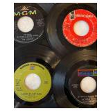 45 rpm records featuring Sly and the Family Stone, Peter, Paul, and Mary, Leslie Gore, Grassroots and more