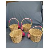 Four nice woven 6-inch baskets with handles