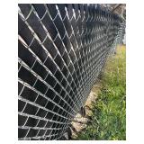 Two rolls of vinyl webbing 100 yards each dress up your chain link fence as pictured