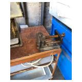 Grinder and vise on table