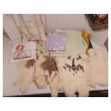 Fur pelts, tall wooden candle holder, cat table runner