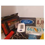 License plates, blood pressure monitor, scale, fan, magnifying glass