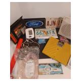 License plates, blood pressure monitor, scale, fan, magnifying glass