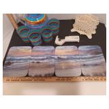 Pitcher and glasses, can opener, painted cast iron napkin holder, glass beach scene plates