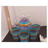 Pitcher and glasses, can opener, painted cast iron napkin holder, glass beach scene plates