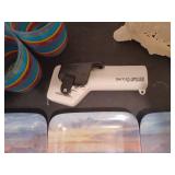 Pitcher and glasses, can opener, painted cast iron napkin holder, glass beach scene plates