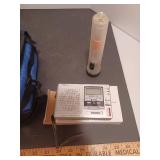 Sleeping bag NIB, poncho, battery charger, umbrella, lunch tote