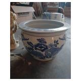 Large blue planter, cat stone and cherub bird baths