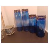 4 Cobalt canisters and 2 flowerpots