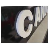 Black Background White Lettering Candy City Signs