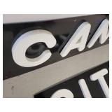 Black Background White Lettering Candy City Signs