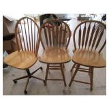 Unmatched swivel bar chairs