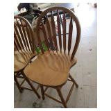 Unmatched swivel bar chairs