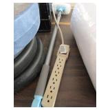 Power strip and cleaning brush
