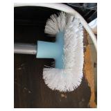 Power strip and cleaning brush