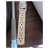 Power strip and cleaning brush