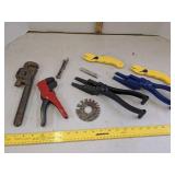 Pipe wrench, box opener, wire cable stripper & nail guides