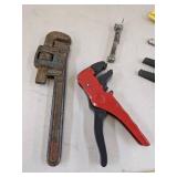 Pipe wrench, box opener, wire cable stripper & nail guides