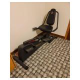 Pro-Form Rebel Recumbent Bike and Elliptical Crosstrainer Located in Basement