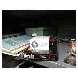 Misc. office supplies- stapler- paper- CD rack- turtle figurine- pen holder