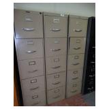 Three metal filing cabinets