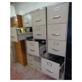 Three metal filing cabinets