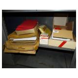n95 masks, tape dispenser, packing envelopes, folders