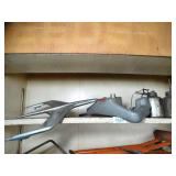 Contents on Shelf - Hood Ornament and Plane Controller - Oil Cans