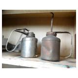 Contents on Shelf - Hood Ornament and Plane Controller - Oil Cans