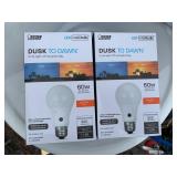 2 New Automatic Dusk To Dawn Soft White Lights Bulbs.