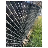 Two rolls of vinyl webbing 100 yards each dress up your chain link fence as pictured